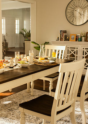 Brown and white dining room table with food